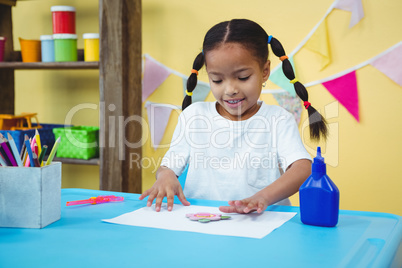 Happy girl making arts and crafts