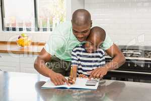 Father helping his son with homework