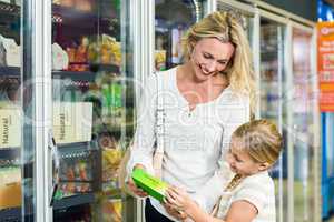 Mother and daughter buying food