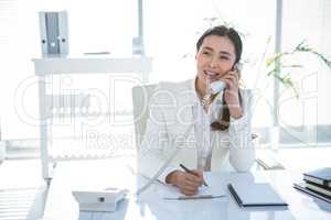 Smiling businesswoman on her telephone