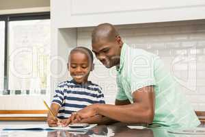 Father helping his son with homework