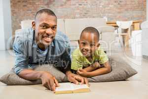 Father and son reading on the floor