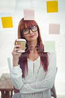 Attractive hipster woman with coffee cup