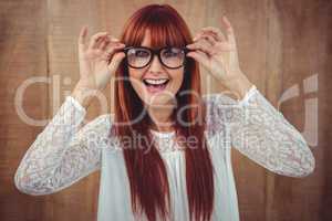 Smiling hipster woman posing face to the camera