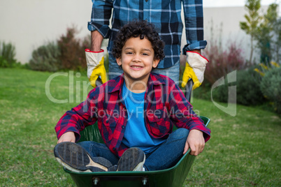 Smiling child in the barrow