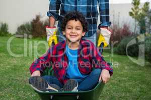 Smiling child in the barrow