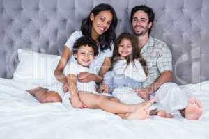 Happy family on the bed