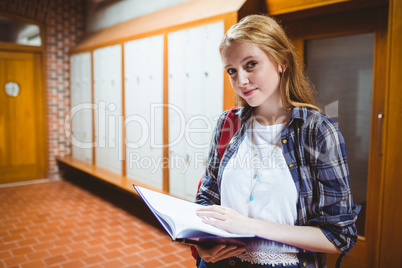 Focused student standing and studying