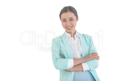 Smiling businesswoman with folded arms