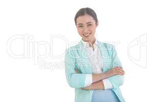 Smiling businesswoman with folded arms