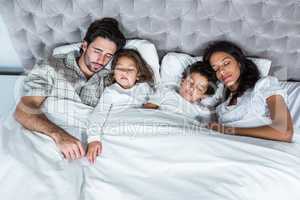 Family sleeping together