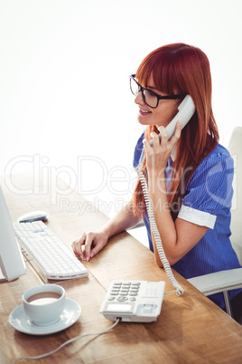 Smiling hipster woman on phone