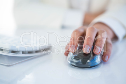 Close up of a woman using a mouse