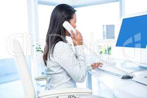 Side view of businesswoman on phone