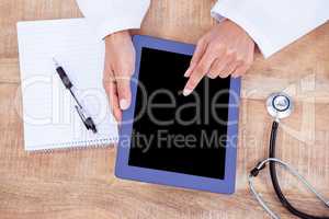 Doctor using digital tablet