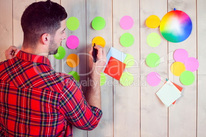 Creative worker using wall for brainstorm