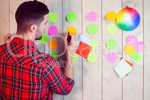 Creative worker using wall for brainstorm