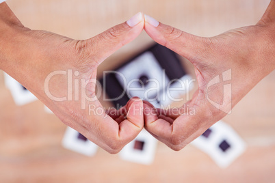 View of hands making heart shape