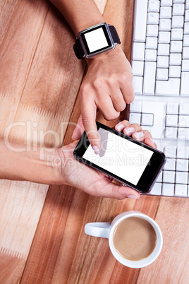 Feminine hands using smartphone and smart watch