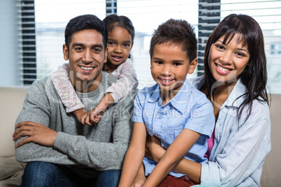 Smiling family on the sofa