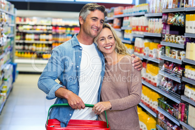Happy smiling young couple doing shopping