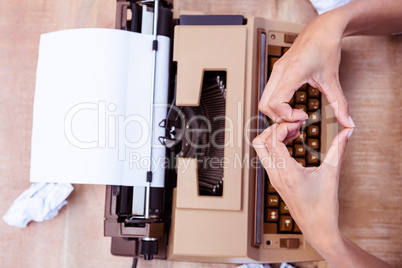 Above view of typewriter and old phone