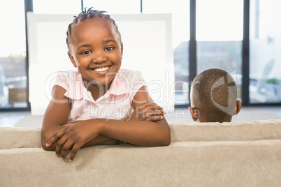 Two children sitting on sofa