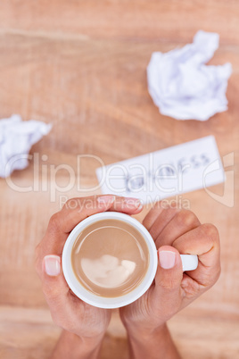 Above view of paper ball and coffee