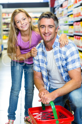 Father and daughter at the supermarket