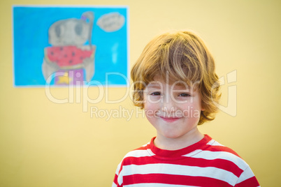 Smiling boy standing in front of the camera