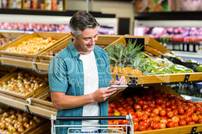 Smiling man looking at his list