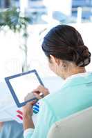 Businesswoman using her tablet pc