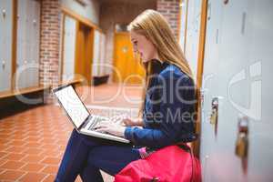 Smiling student sitting at the computer