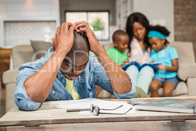 Man with bills and calculator