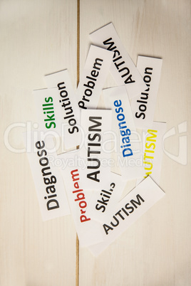 Autism words on wooden table