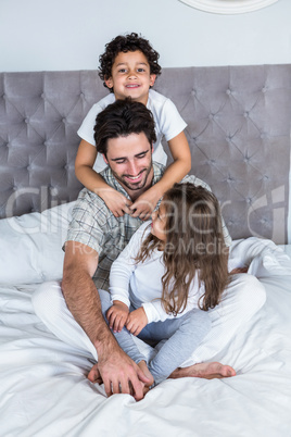 Happy family on bed