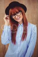 Smiling hipster woman posing face to the camera