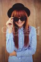 Smiling hipster woman posing face to the camera