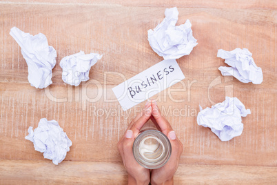 Businesswoman holding a glass of water