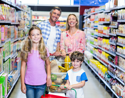 Happy family at the supermarket