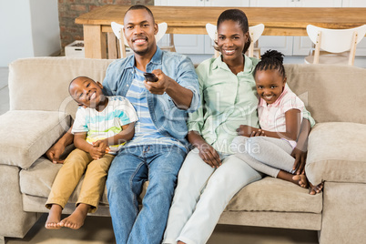 Happy family relaxing on the couch