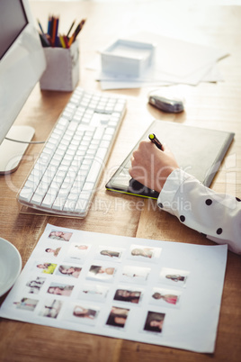 Cropped image of woman using graphics tablet