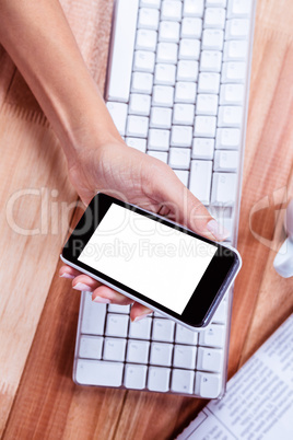 Businesswoman holding her smartphone