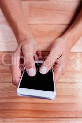 Part of hands typing on smartphone