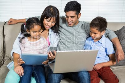 Smiling family on the sofa