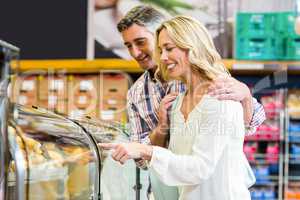 Happy couple buying food