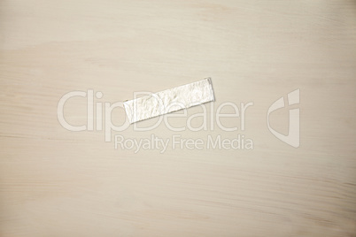 Chewing gum wrapper on wooden desk
