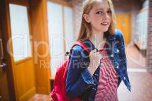 Pretty student with backpack looking at the camera