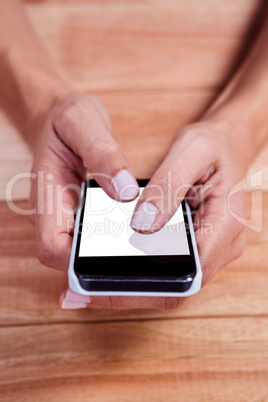 Part of hands typing on smartphone