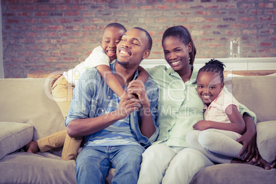 Happy family relaxing on the couch